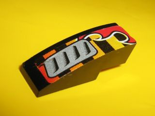 Lego Slope, Curved 3 x 1 with Silver Vent and Red Flame Pattern Model Left (Sticker) - Set 8648 / Black