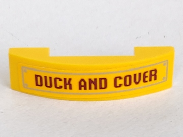 Lego Slope, Curved 4 x 1 x 2/3 Double with 'DUCK AND COVER' Pattern (Sticker) - Set 70909 / Yellow