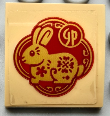 Lego Slope, Curved 2 x 2 x 2/3 with Gold and Red Rabbit and Chinese Logogram '卯' (Sign of the Rabbit) Pattern (Sticker) - Set 80111 / Tan