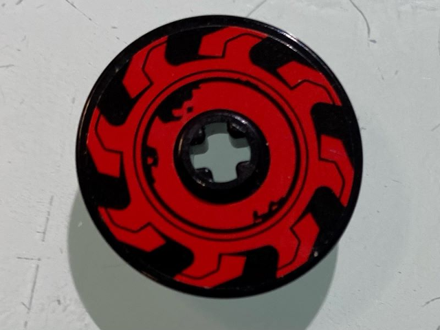 Lego Technic, Disk 3 x 3 with Red Circular Saw Blade Pattern Model Left Side (Sticker) - Set 70639 / Black