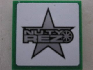 Lego Tile 2 x 2 with 'NUTY REZ' on White Background Pattern (Sticker) - Set 8495