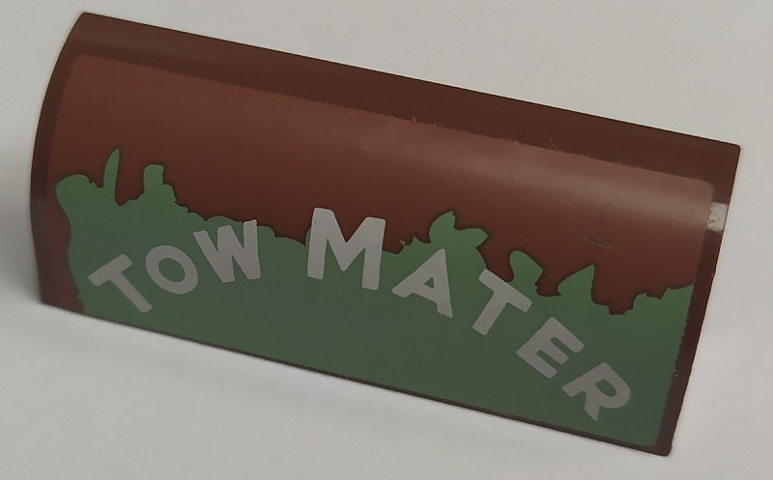 Lego Slope, Curved 1 x 4 x 1 1/3 with White 'TOW MATER' on Worn Sand Green Background Pattern Model Right Side (Sticker) - Set 8677