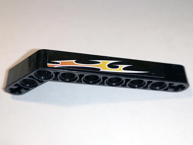 Lego Technic, Liftarm, Modified Bent Thick 1 x 9 (7 - 3) with Orange Flames Pattern Left Side B (Sticker) - Set 8167 / Black