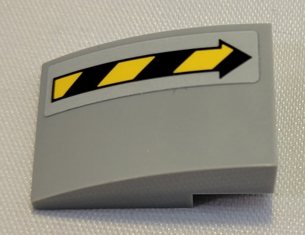 Lego Slope, Curved 3 x 2 with Black and Yellow Danger Stripes Arrow Pattern Model Right Side (Sticker) - Set 21331 / Light Bluish Gray