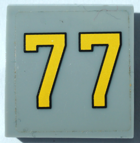 Lego Slope, Curved 2 x 2 x 2/3 with Yellow Number 77 Pattern (Sticker) - Set 76037 / Light Bluish Gray