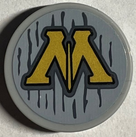 Lego Tile, Round 2 x 2 with Bottom Stud Holder with Gold Capital Letter M (Ministry of Magic Logo) and Dark Bluish Gray Lines Pattern (Sticker) - Set 76403