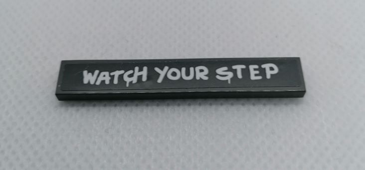 Lego Tile 1 x 6 with 'WATCH YOUR STEP' Pattern (Sticker) - Set 75977 / Dark Bluish Gray