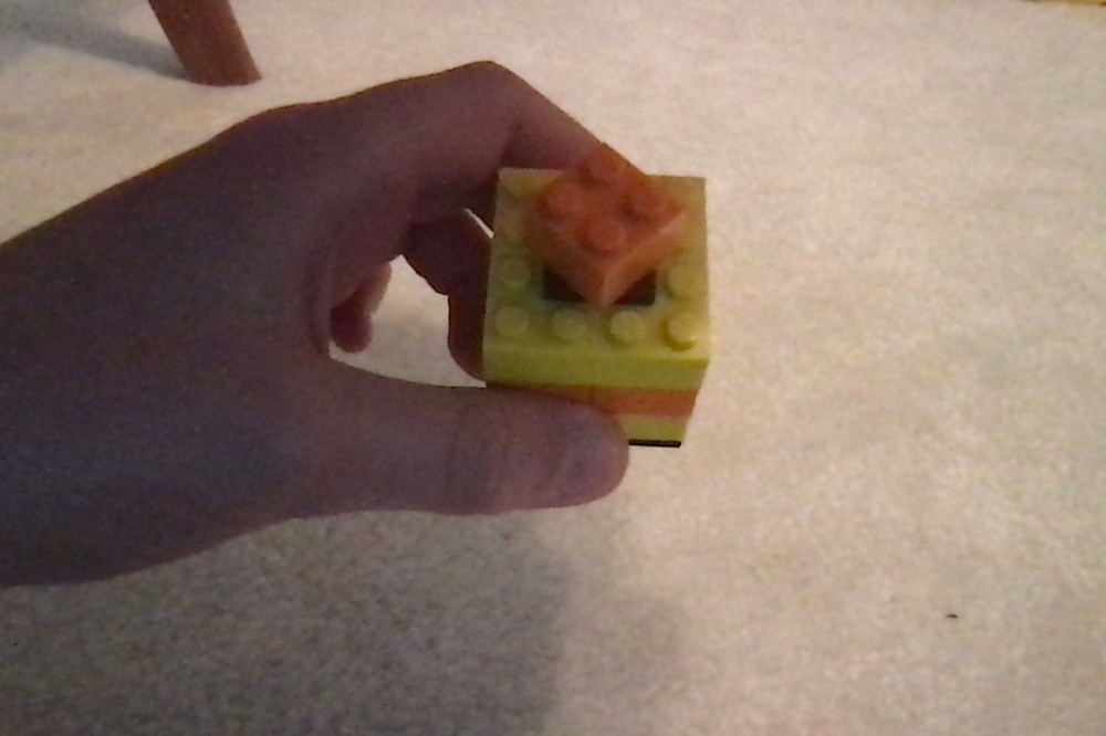 Lego tiny orange and yellow present