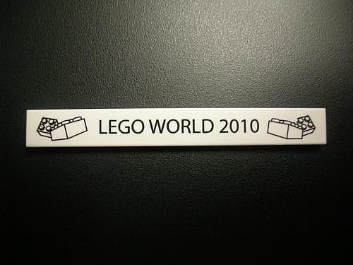 Lego Tile 1 x 8 with 'LEGO WORLD 2010' and Bricks Pattern / White
