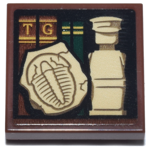 Lego Tile, Modified 2 x 2 Inverted with Reddish Brown and Dark Green Books, Gold Trim and Letters T and G, Tan Legoland Minifigure and Trilobite Fossil Pattern (Sticker) - Set 21355 / Reddish Brown
