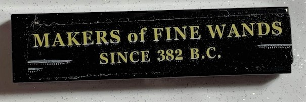 Lego Tile 1 x 4 with 'MAKERS of FINE WANDS SINCE 382 B.C.' Pattern (Sticker) - Set 75978 / Black
