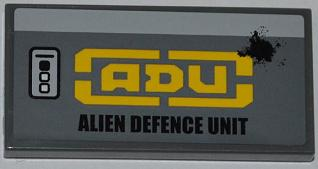 Lego Tile 2 x 4 with Buttons and 'ADU ALIEN DEFENCE UNIT'  Pattern Model Left Side (Sticker) - Set 7066