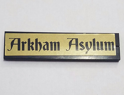 Lego Stickered Assembly 8 x 2 with Black 'Arkham Asylum' on Gold Background Pattern (Sticker) - Set 7785