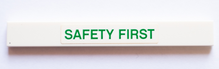 Lego Tile 1 x 8 with Green 'SAFETY FIRST' Pattern (Sticker) - Set 42064