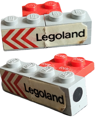 Lego Stickered Assembly 4 x 3 x 1 with 'Legoland' and Red Chevrons on Side and Black Dot Pattern on Both Ends Model Left Side (Stickers) - Set 687