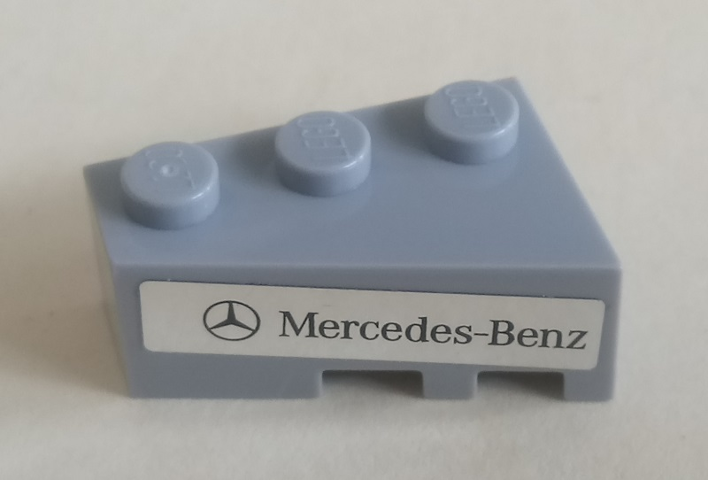 Lego Wedge 3 x 2 Left with Mercedes-Benz Logo and 'Mercedes-Benz' on Silver Mirrored Background Pattern (Sticker) - Set 75911 / Light Bluish Gray