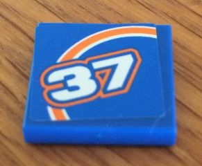 Lego Tile 2 x 2 with Orange Bow and White '37' Pattern Model Left Side (Sticker) - Set 8163 / Blue